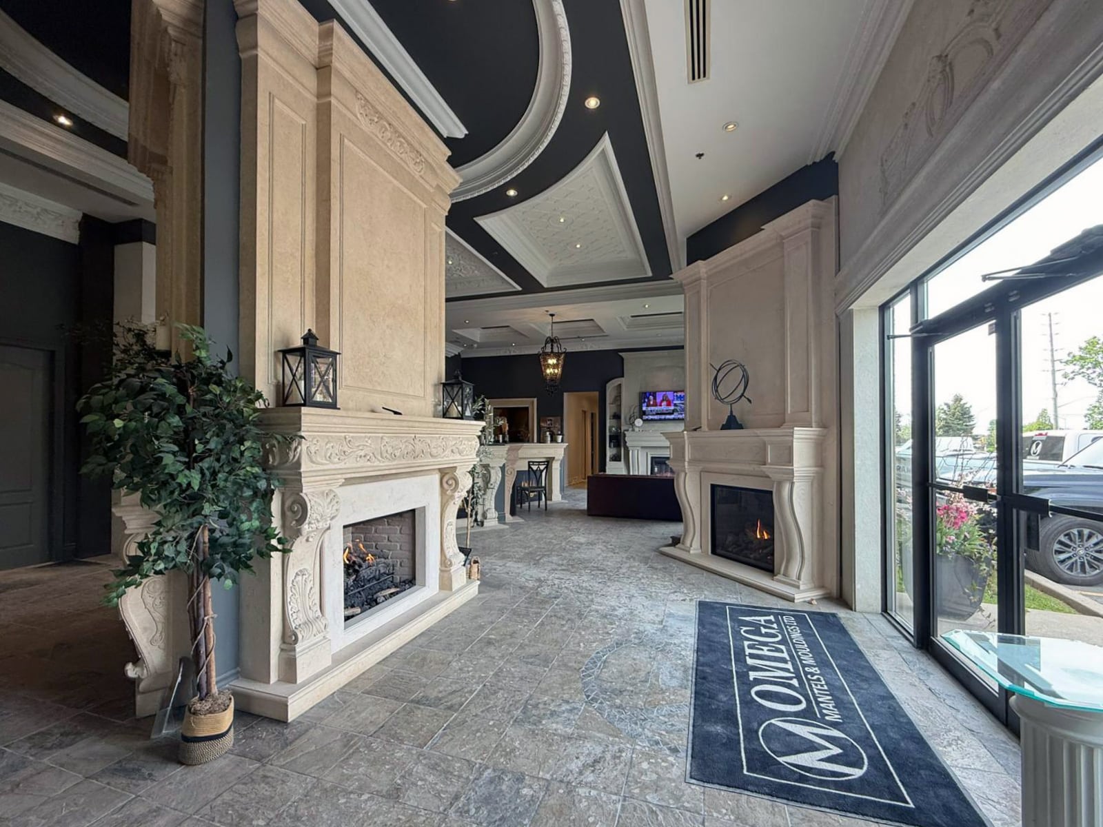 Inside the Omega Flames showroom — fireplaces and cast stone mantels on display in Woodbridge