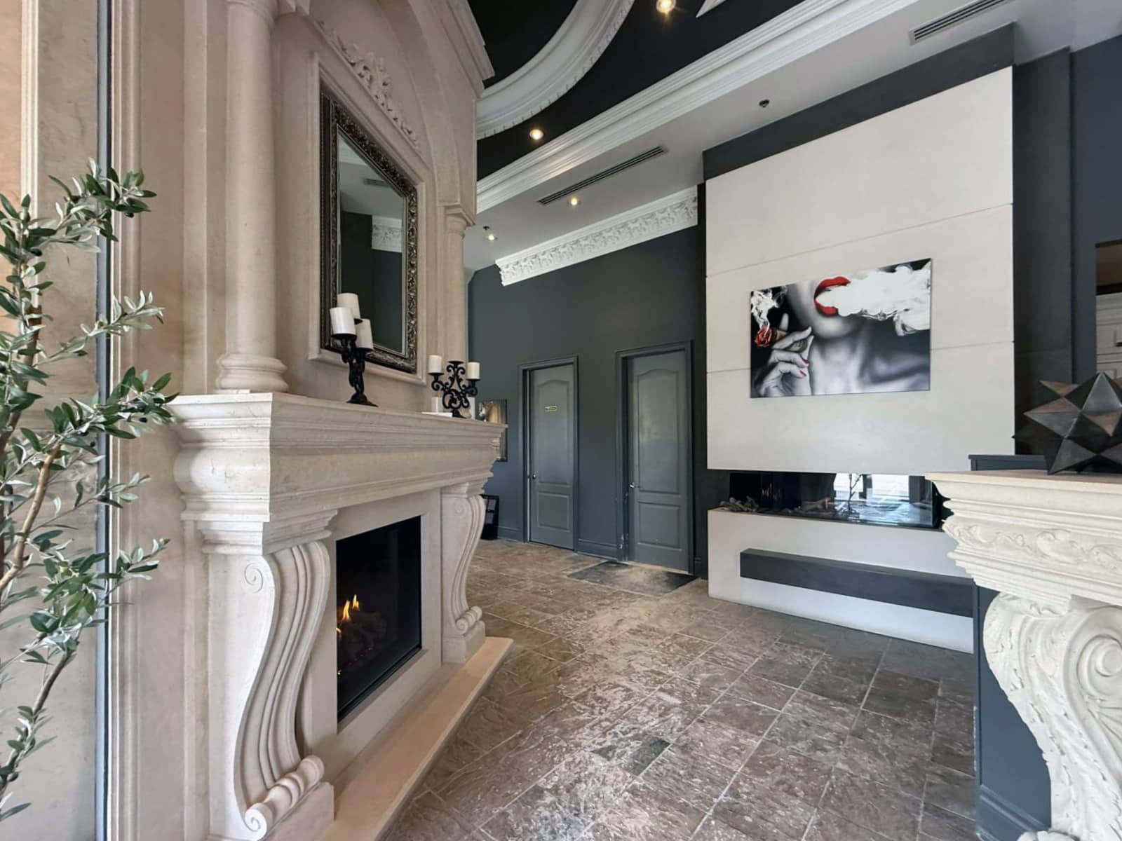 Traditional wood fireplace surround on display at Omega Flames showroom