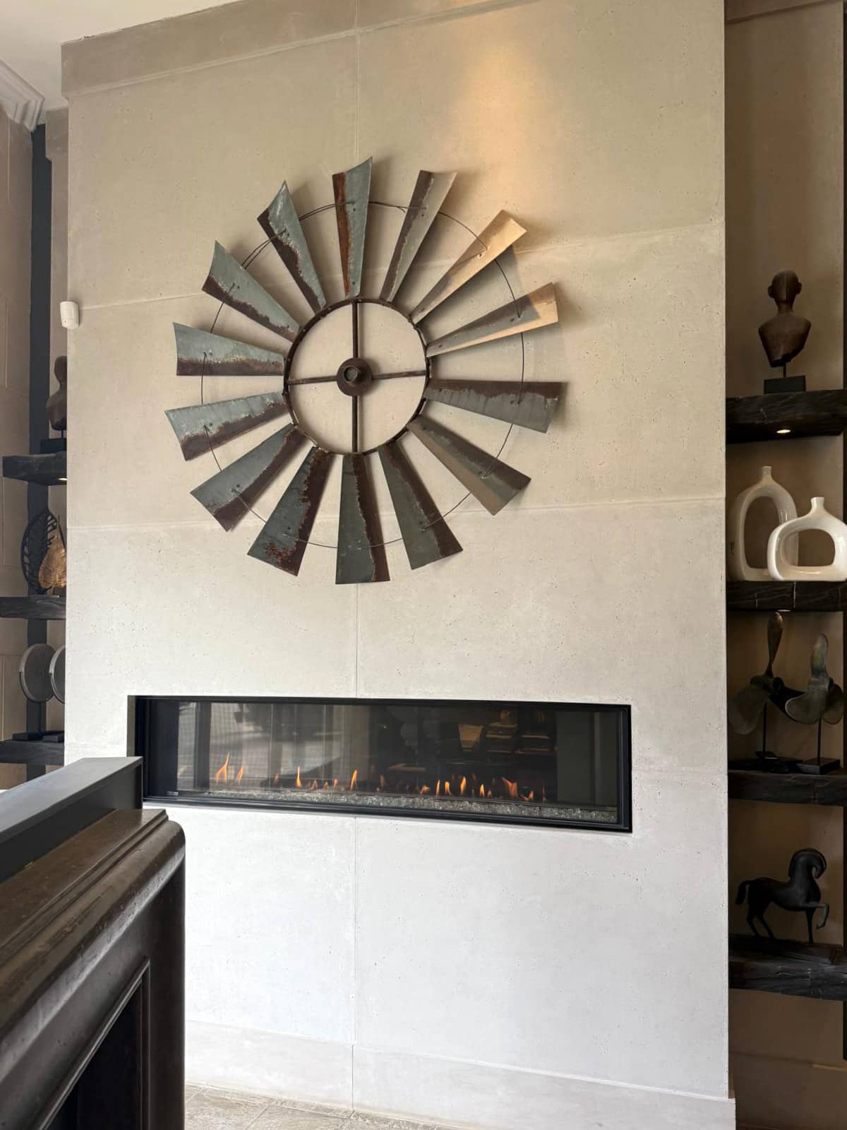 Custom cast stone fireplace surround at Omega Flames Woodbridge showroom